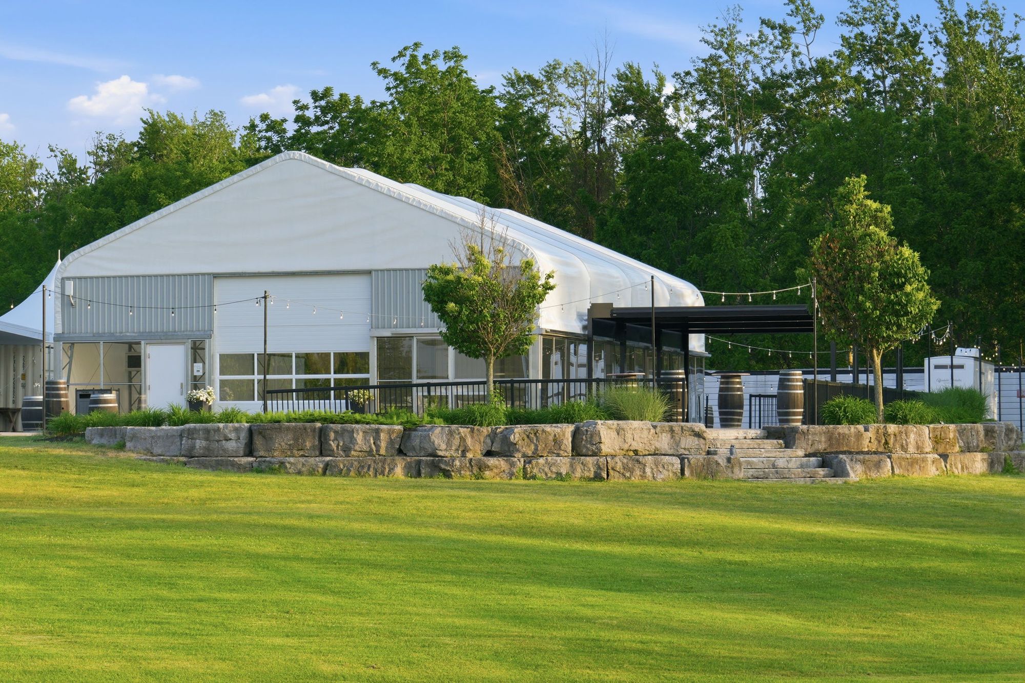 The event space on its stone terrace above the lawn