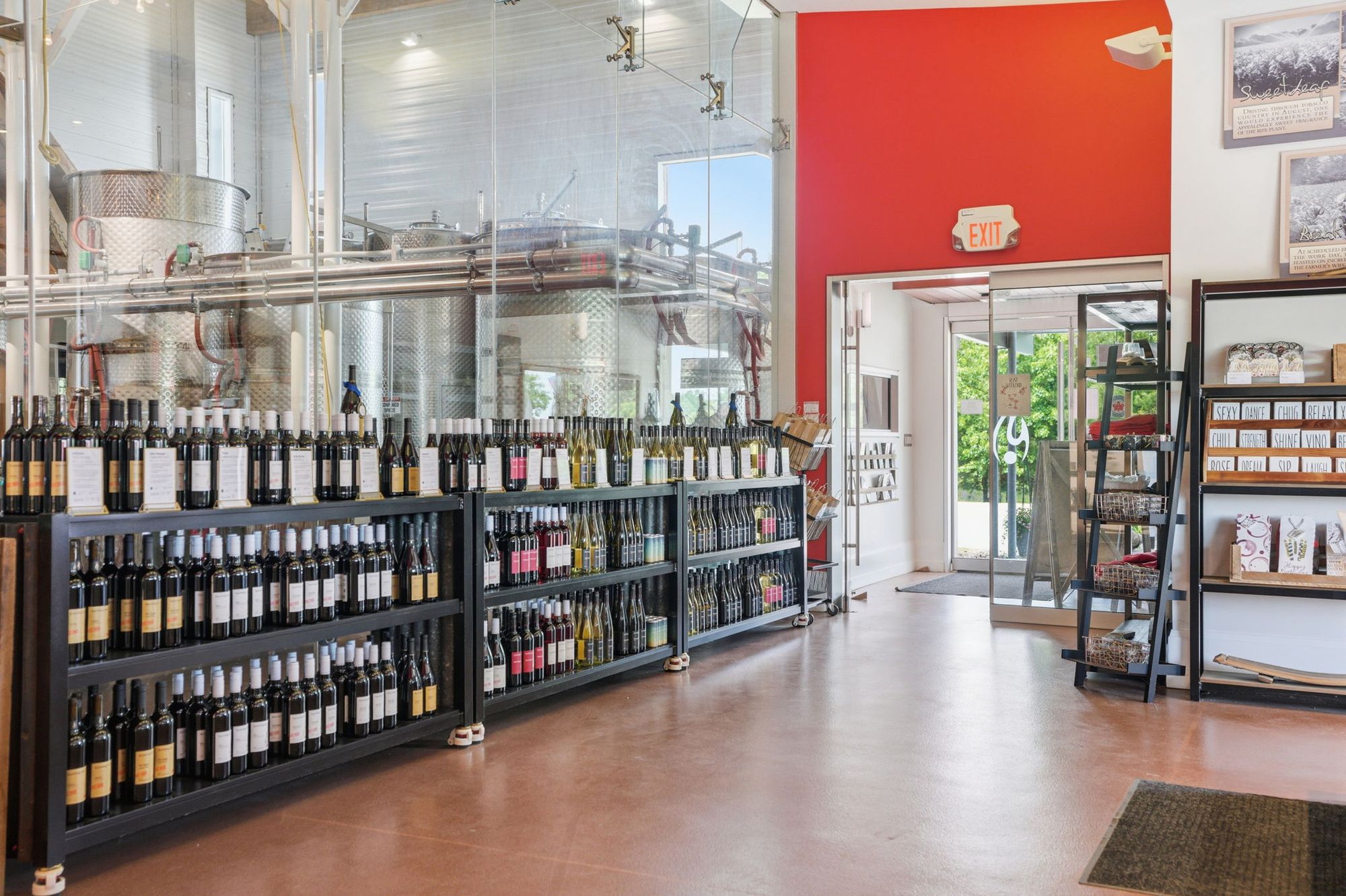 The wine shop, with the production hall through the glass