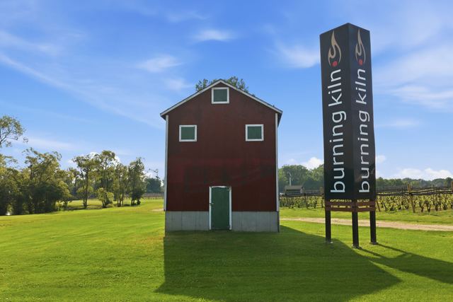 The red kiln-style building and the Burning Kiln sign at the entrance