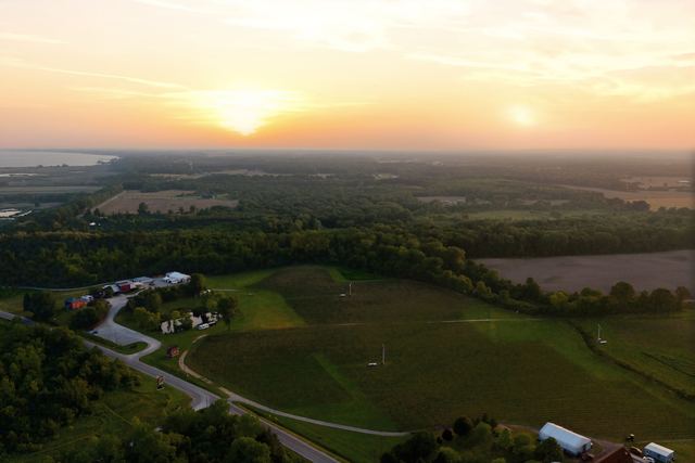 The property and the countryside at sunset, the lake on the horizon